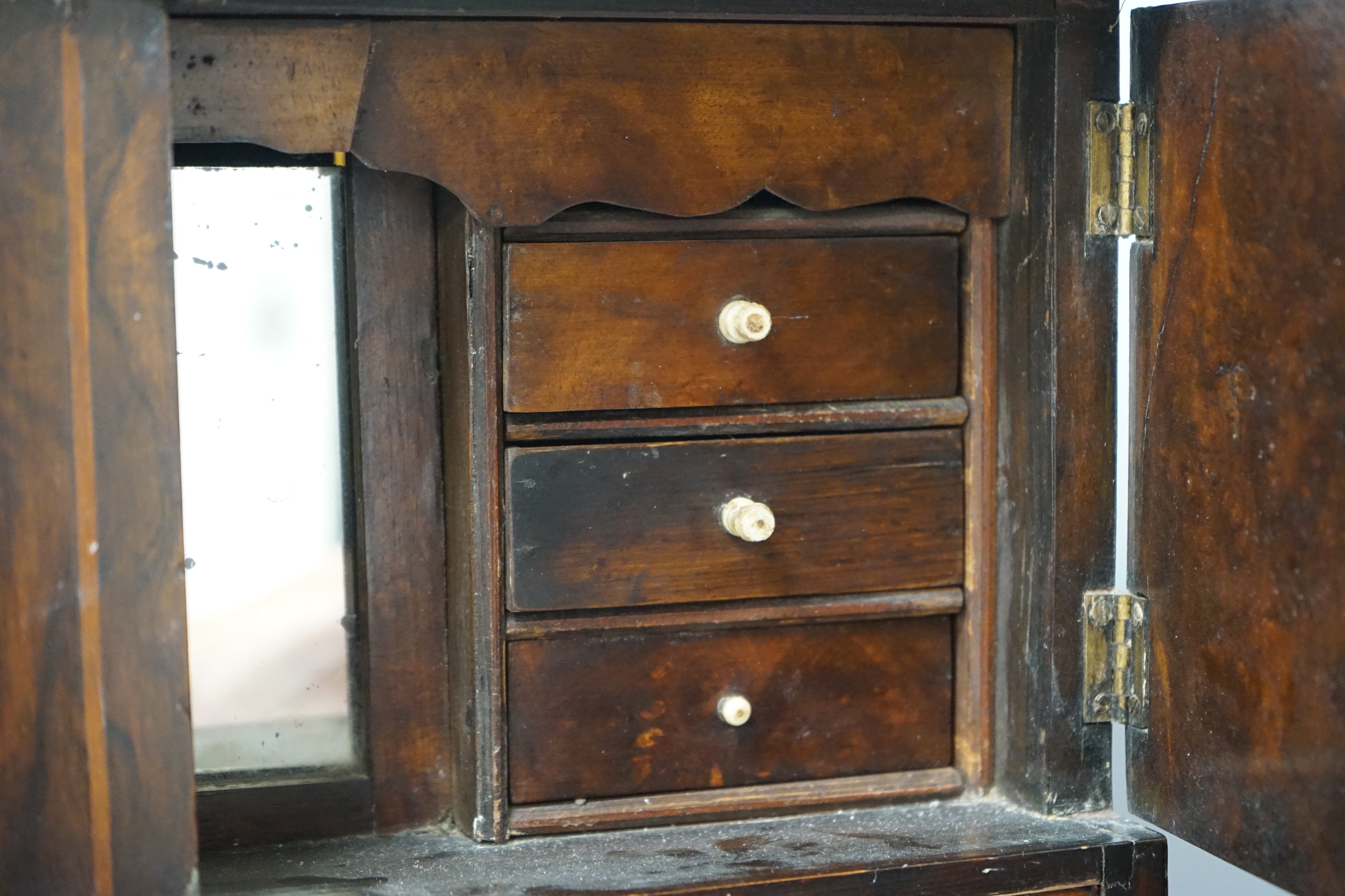 An early Victorian miniature walnut cupboard, 36cm x 50.5cm x 16.5cm